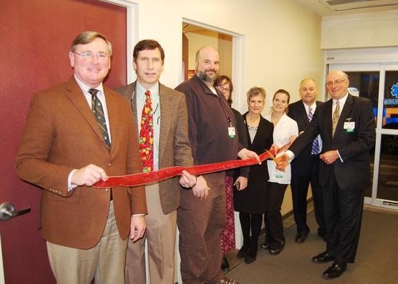 Note the ASM ambulance outside. From left to right: Patrick Mahon, chairman, JMMC Board of Directors; Neil Moynihan, M.D., president, JMH Medical Staff; Paul Wentworth, EMS coordinator; Beth Van Alstyne, senior director, Nursing; Patricia Jagoe, assistant vice president, Patient Care Services; Jennifer Moskal, Emergency Department manager; David Herr, M.D., chairman, Department of Emergency Medicine; and Stuart E. Rosenberg, president & CEO, JMMC. (Gregory Palmer / February 27, 2014)